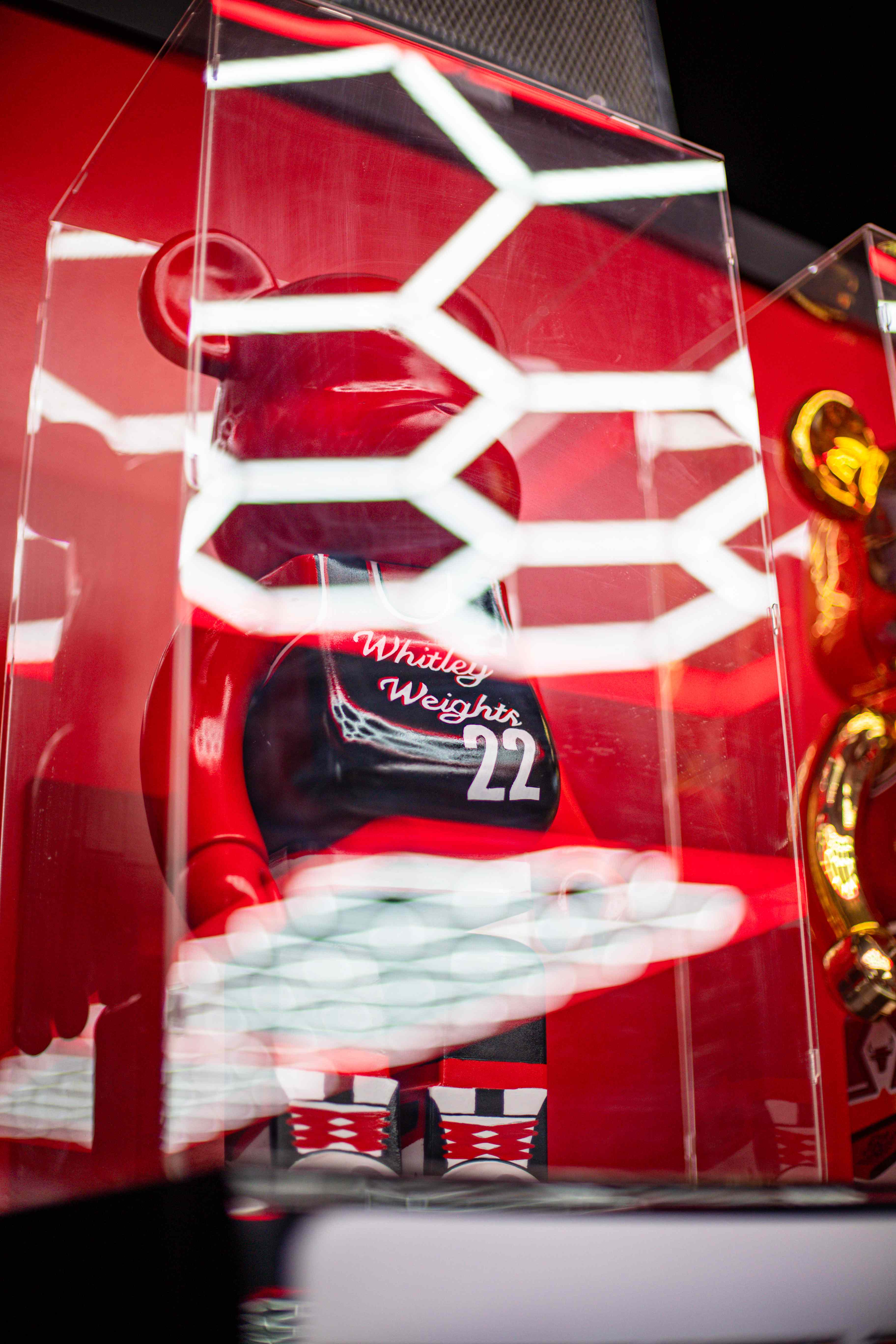 Whitley Weights 22 collectible in a neon-lit case