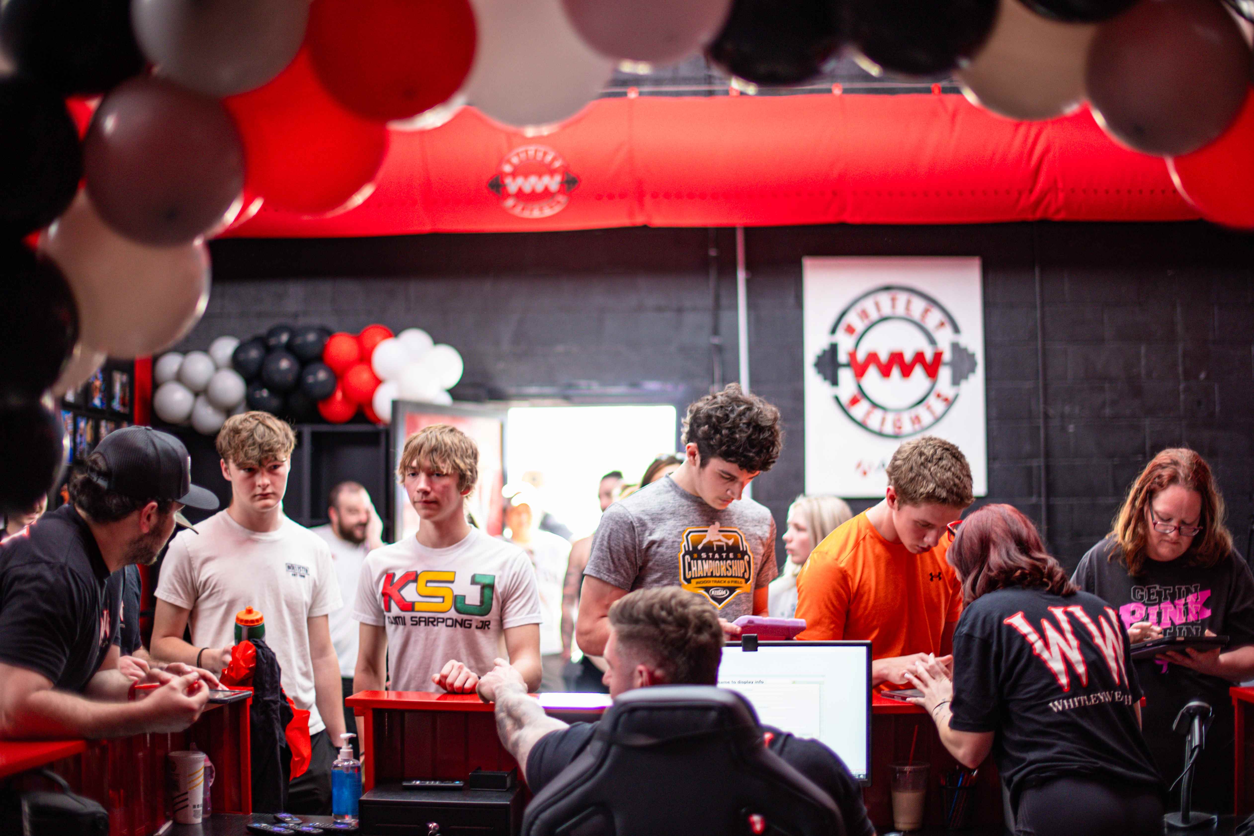 Crowd of members checking in at the front desk during an event